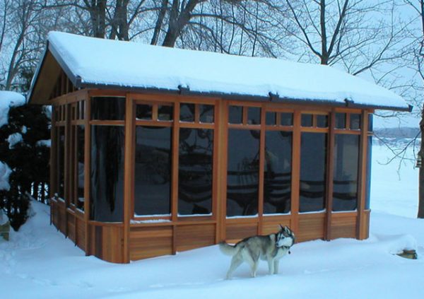 a snow covered chalet gazebo