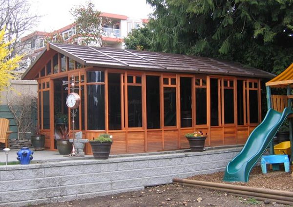 chalet gazebo on concrete deck beside playground