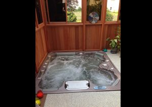 a hot tub inside a gazebo