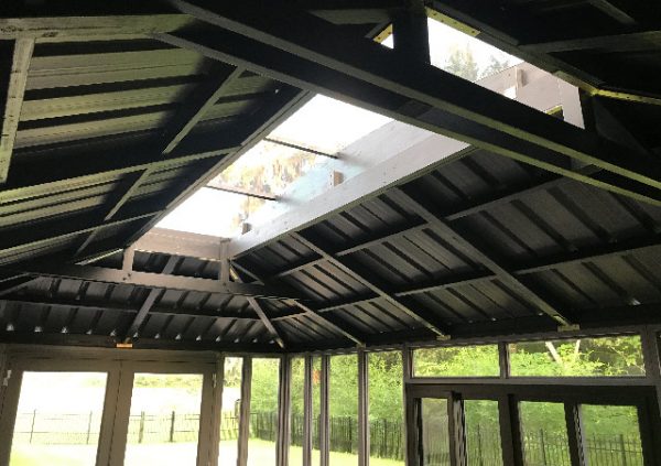 a hot tub with skylight roof