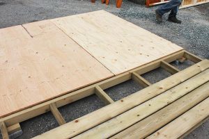 2. Attach plywood sheets to the floor frame and porch boards to the porch frame.