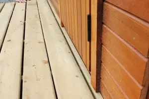 12. Attach the porch board end bar to the floor frame