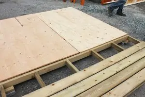 2. Attach plywood sheets to the floor frame and porch boards to the porch frame.