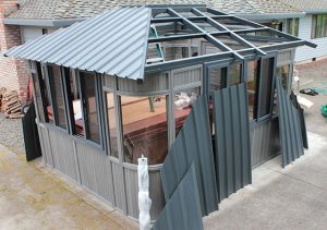 13. Start at the short side of the gazebo and secure a set of Roof Panels.