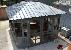 14. Attach the remaining Roof Panels and install the Doors.